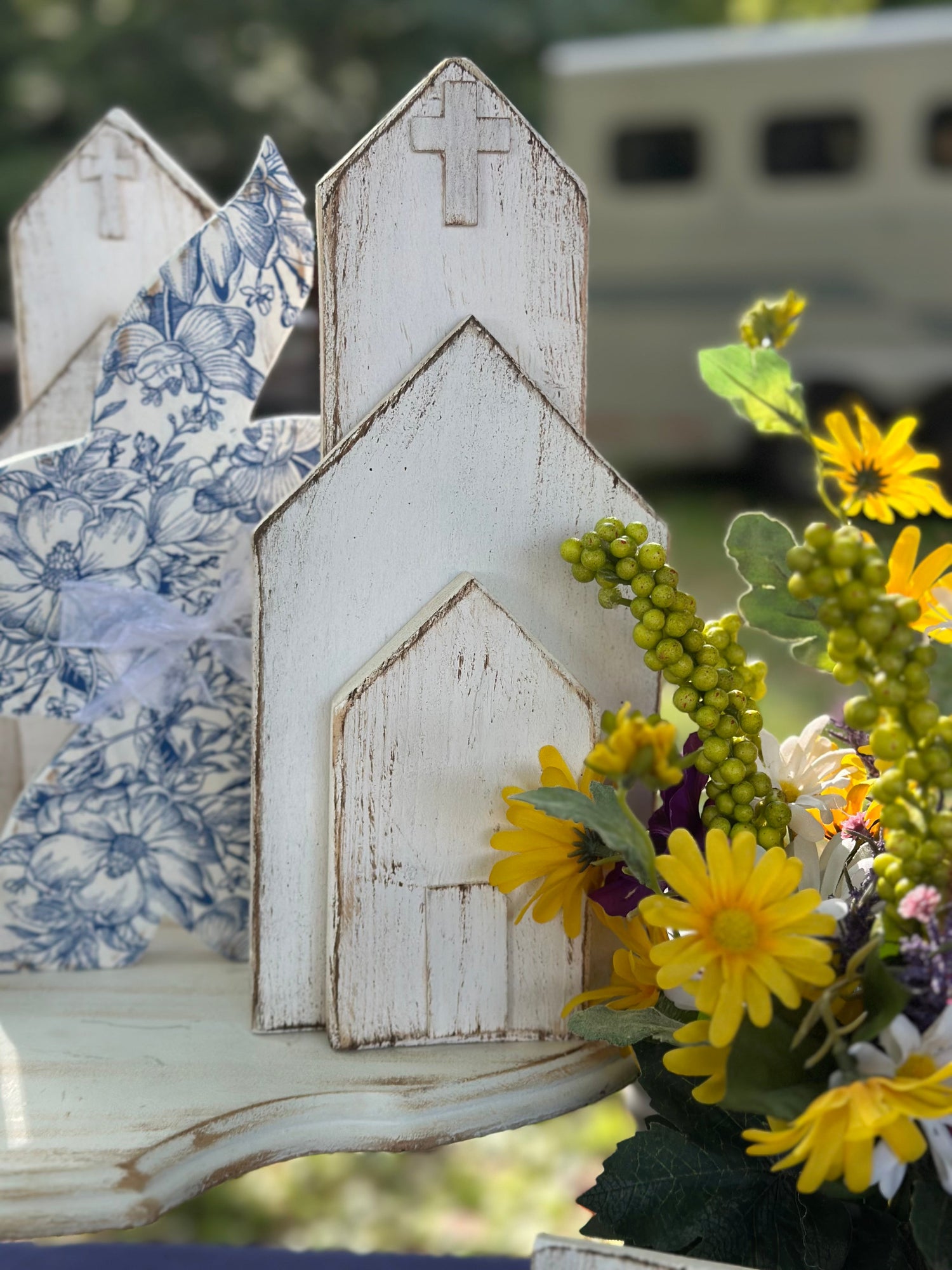 White distressed wooden church and blue decoupage wooden bunny