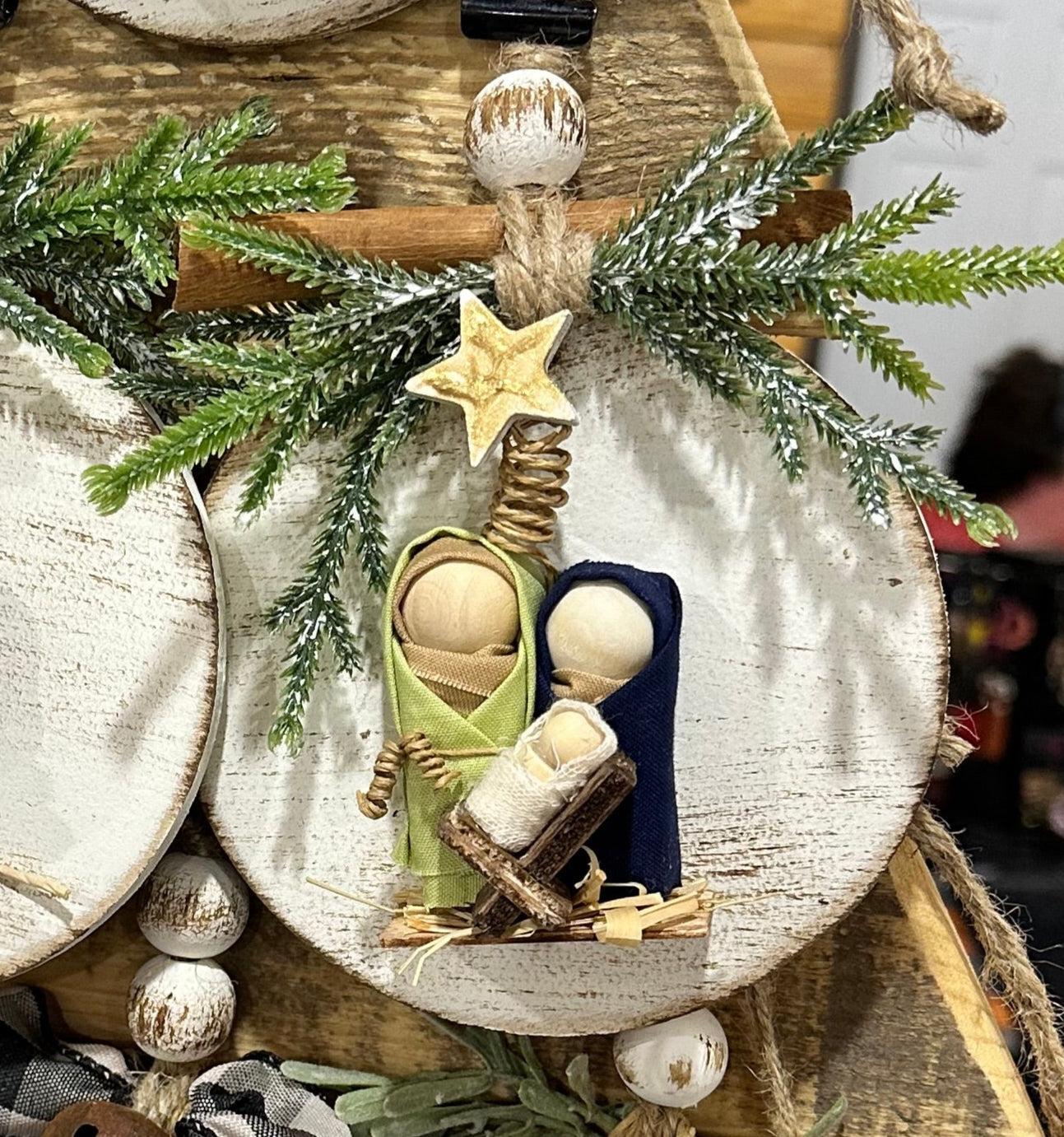 Collection of Christmas-themed decorative items with numbers and phrases on a wooden surface.